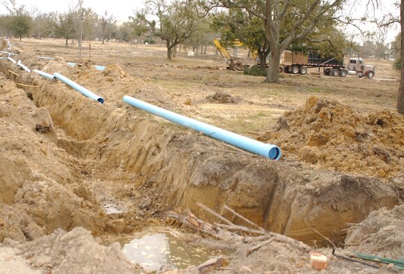 Utility lines in Oak Park are being removed before the land where houses once stood is graded and seeded.