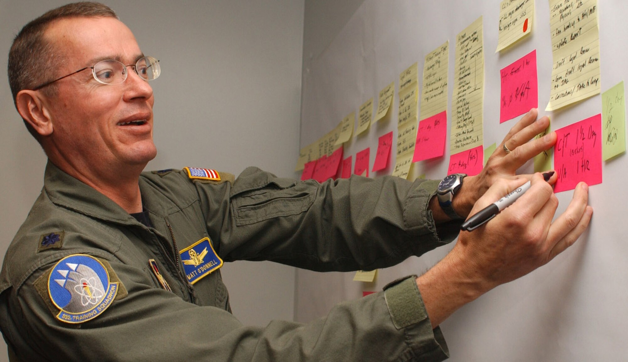 Colonel O’Donnell adds a note to the value stream map for the process.