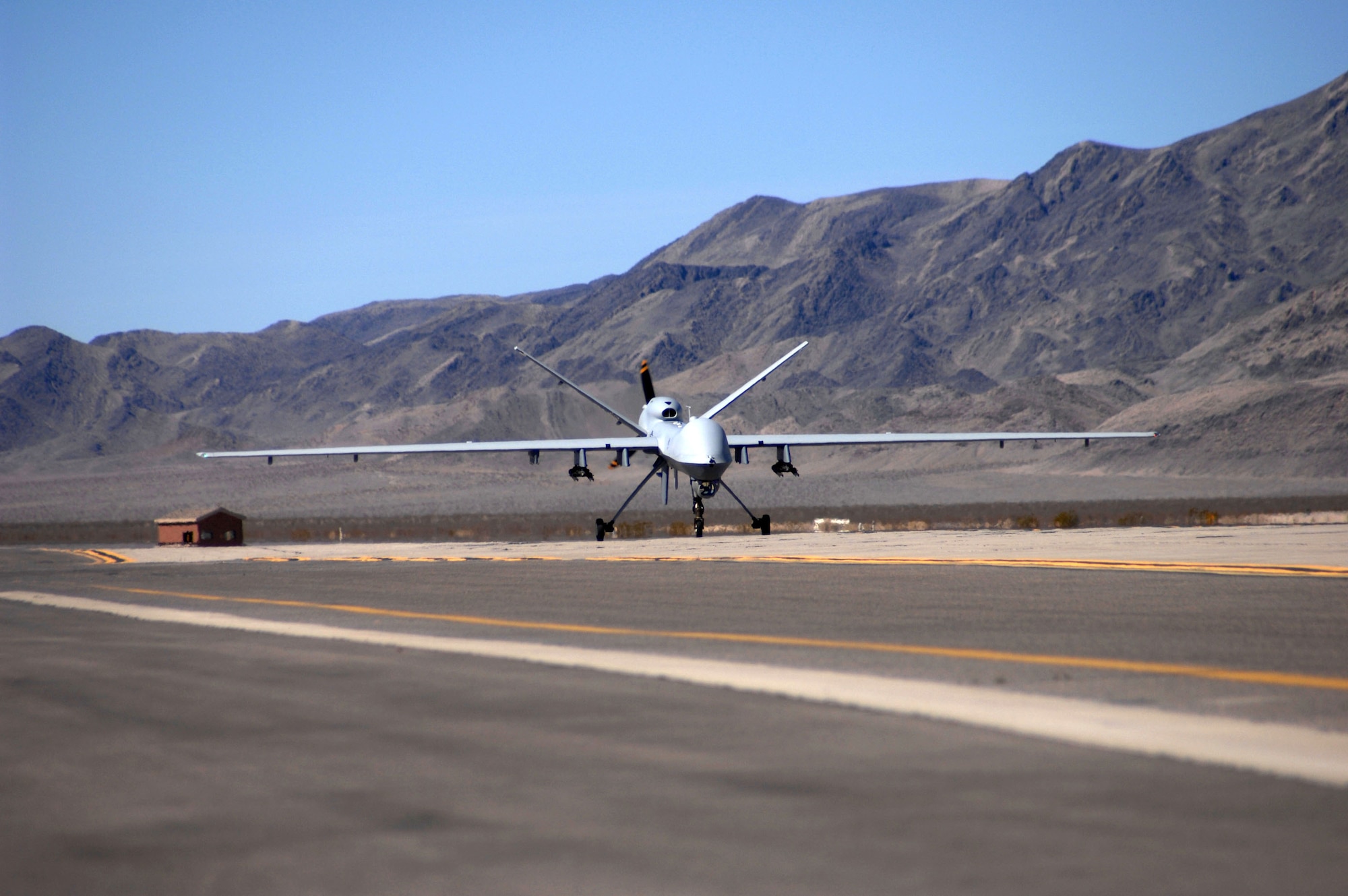 An MQ-9 Reaper Unmanned Aerial Vehicle taxis into Creech Air Force Base, Nev., March 13. It is the first operational airframe of its kind to land here. This Reaper is the first of many to be assigned to the 42nd Attack Squadron. (U.S Air Force photo/Senior Airman Larry E. Reid Jr.)

