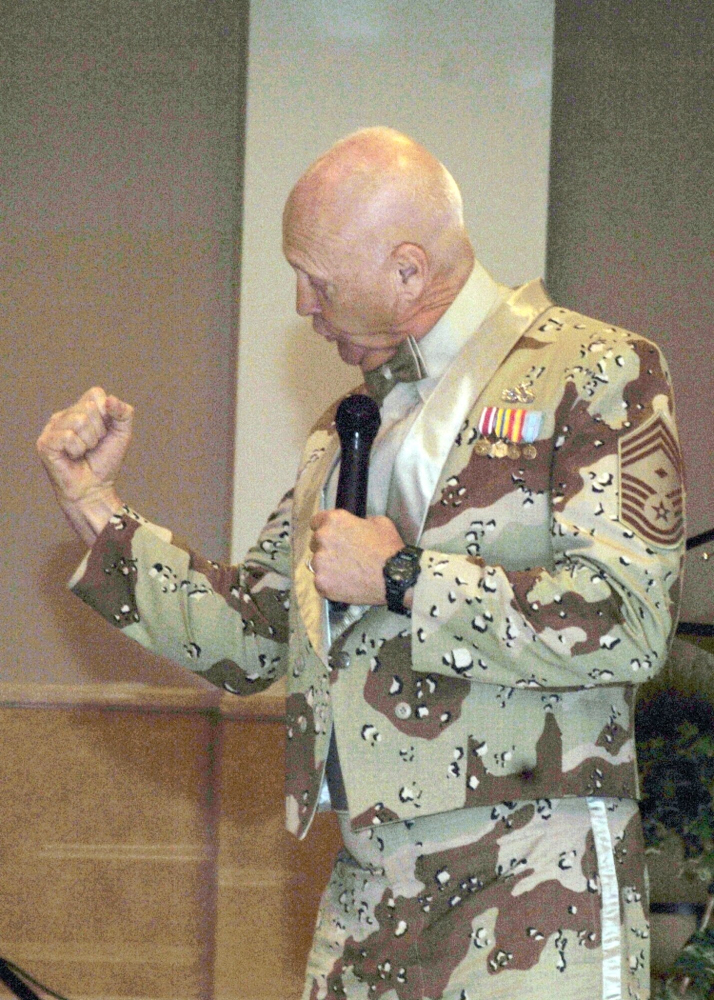 GRAND FORKS AIR FORCE BASE, N.D. – Chief Master Sgt. (Ret.) Terry Savoie gestures during his speech at the 319th Maintenance Group Knucklebuster Awards Ceremony here March 10.  The chief’s message focused on the importance of leaders to impress new recruits within 10 days of arrival and cautioned that missing the 10-day window will cause the Air Force to lose good Airmen (U.S. Air Force photo/Staff Sgt. Suellyn Nuckolls). 