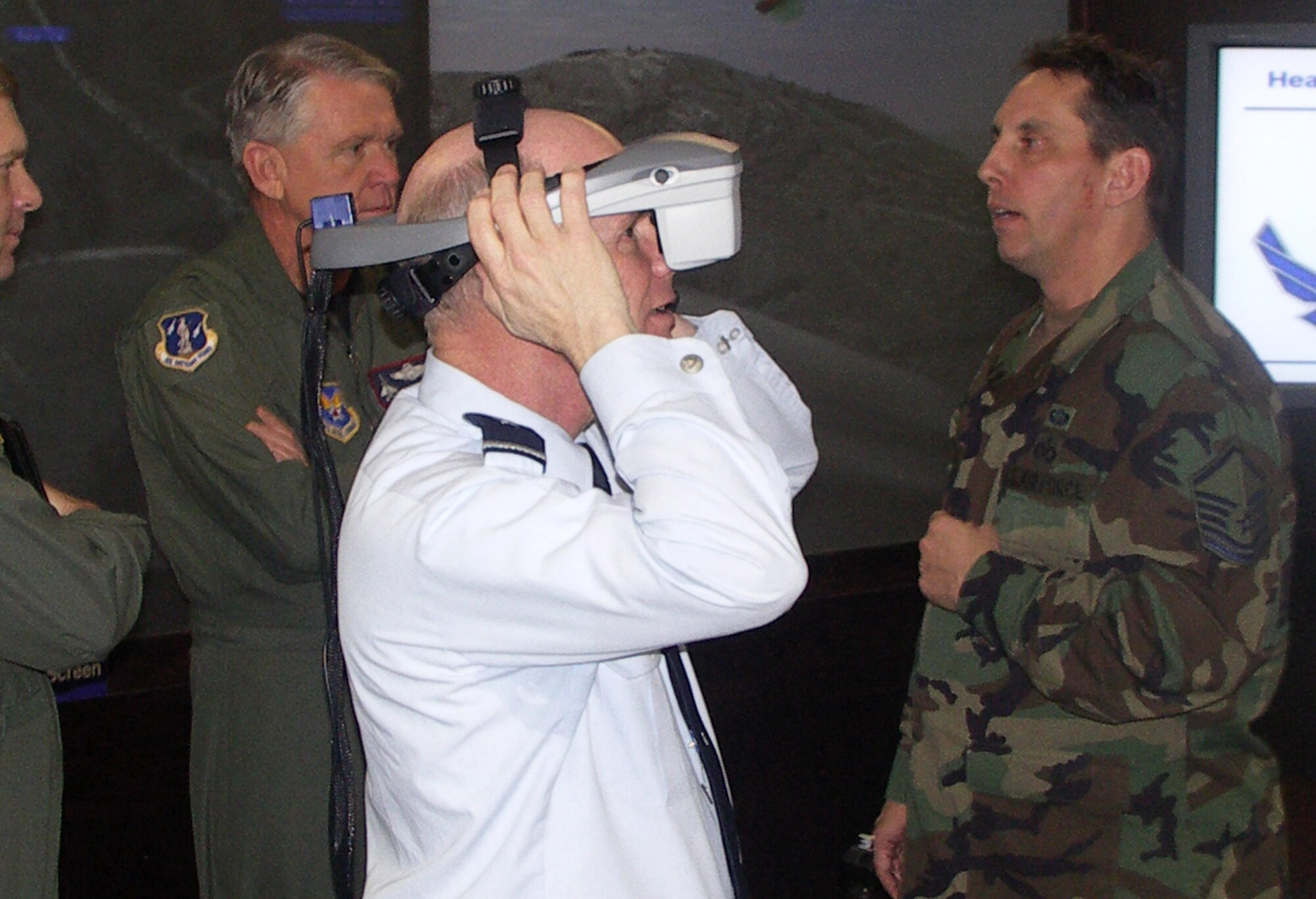 Brig. Gen. Charles Morgan III, Air National Guard assistant to the deputy chief of warfighting integration, calls in virtual air support March 7 during a Virtual Flag simulation exercise held at the Pentagon's C4ISR Visualization Center. The exercise connects participants from around the U.S. and helps joint tactical air controllers experience the challenges of calling in air strikes without being in danger. (U.S. Air Force photo)