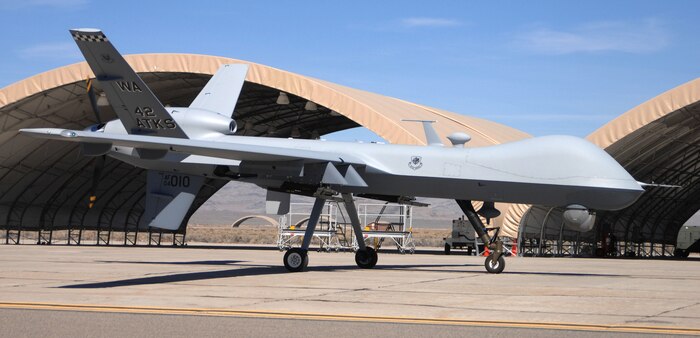 The first operational MQ-9 Reaper sits on the ramp at Creech Air Force Base, Nev., March 13. The remotely piloted aircraft is larger than the MQ-1 Predator, can carry up to 3,000 pounds of weapons, cruise at 50,000 feet and remain airborne for more than 24 hours. The Reaper is assigned to the 42nd Attack Squadron. (U.S Air Force Photo by Senior Airman Larry E. Reid Jr.)