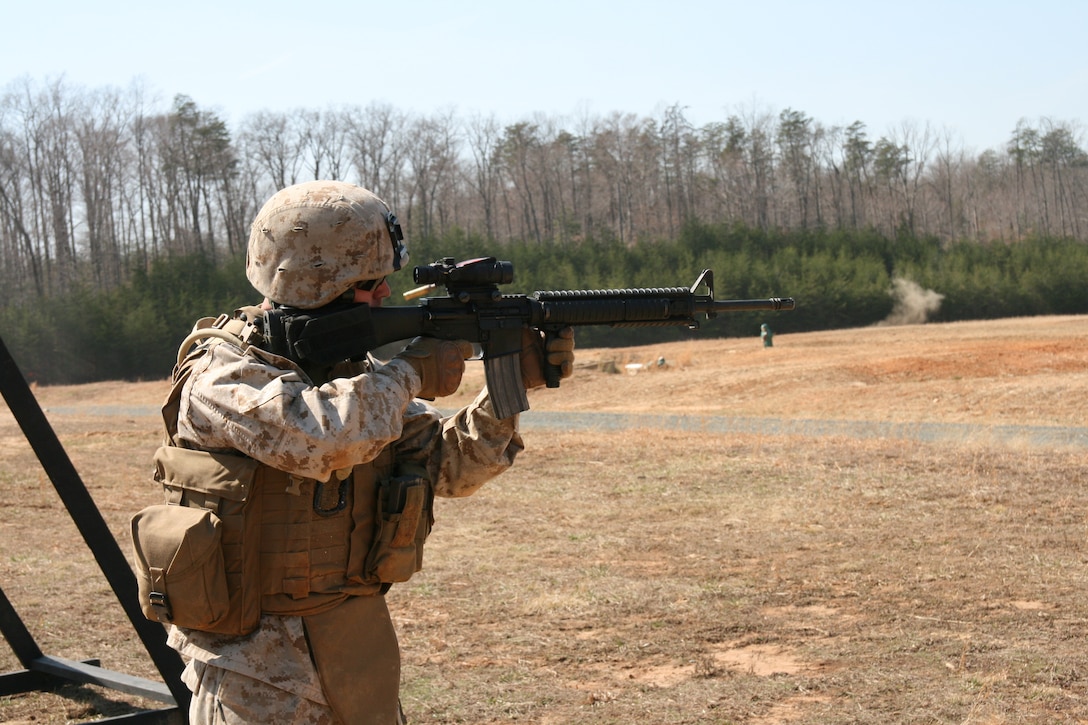 Lance Cpl. Benjamin R. Ledbetter of Company D, 4th Combat Engineer Battalion, fires his M-16A4 rifle from the standing position during Marine Corps Combat Marksmanship Program training at Range 305 aboard Marine Corps Base Quantico, Va., March 13.