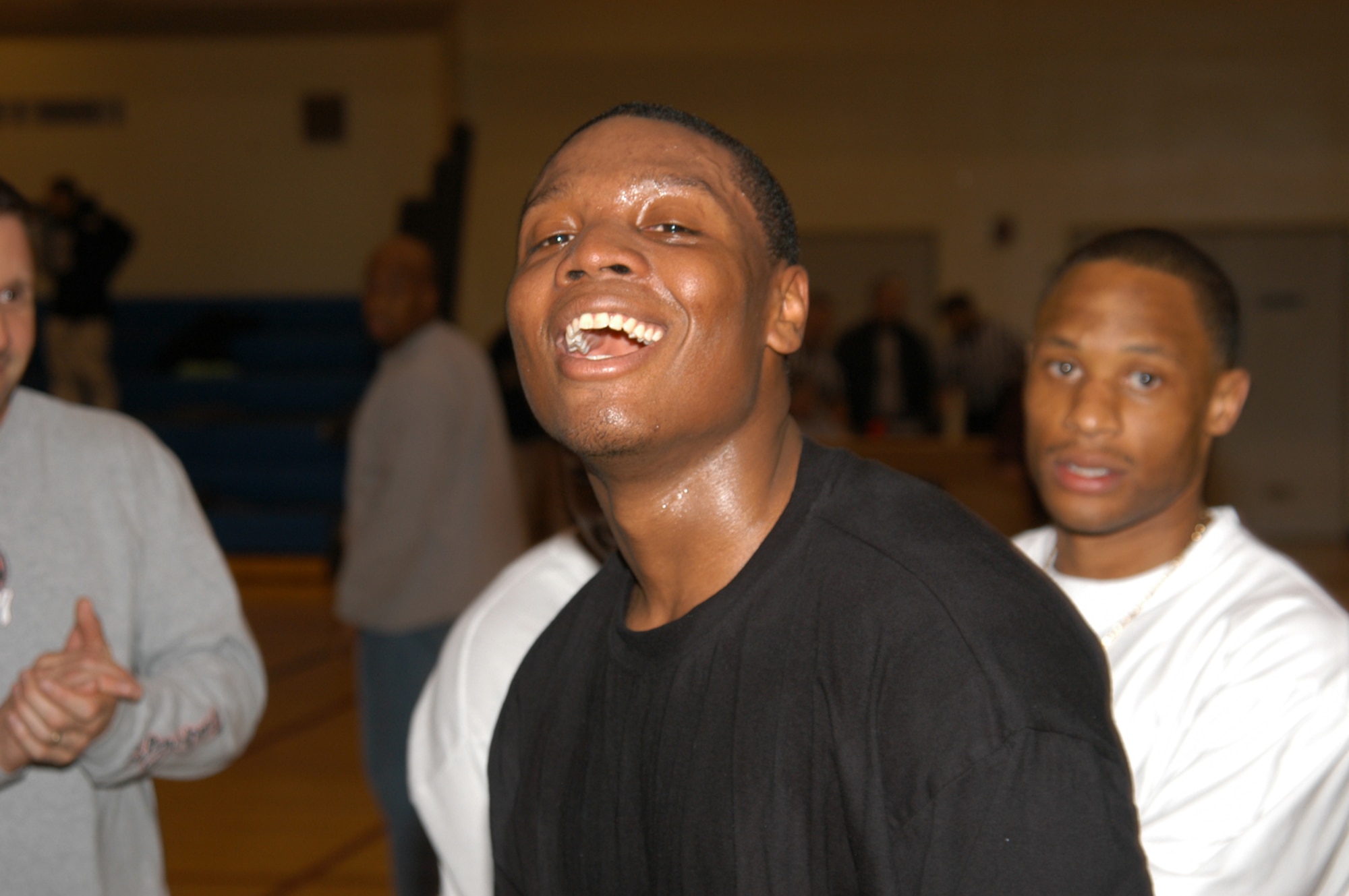 KUNSAN AIR BASE, Republic of Korea March 9, 2007 -- Cobra point guard Casey Tramble celebrates his team's 51-50 victory over the 8th Civil Engineer Squadron 'Red Devils' March 9 during the 2006-2007 intramural basketball championship game. The Cobras, or 8th Aircraft Maintenance Squadron, ended the season with 19 wins and three loses. (Air Force photo/Senior Airman Stephen Collier)