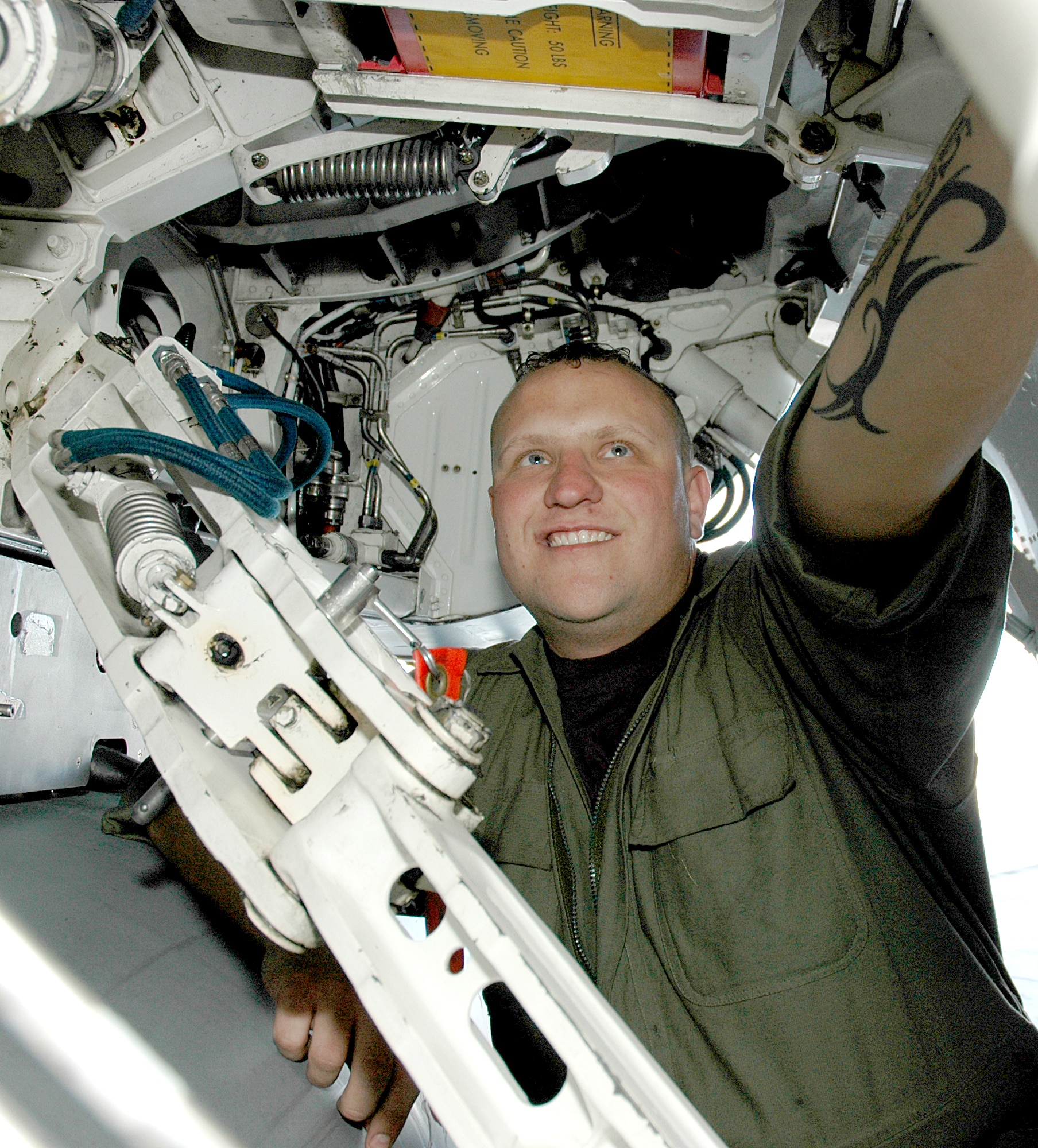 MOUNTAIN HOME AIR FORCE BASE, Idaho -- Staff Sgt. Jared O. Ralphs, a dedicated crew chief with the 389th Aircraft Maintenance Squadron here, checks the hydraulic pressure line on an F-16 March 15.  Sergeant Ralphs received the 2006 Chief Master Sgt. of the Air Force Thomas N. Barnes Award as the numbered Air Force's best crew chief of the year.  Air Force photo by Airman Samantha S. DeVries