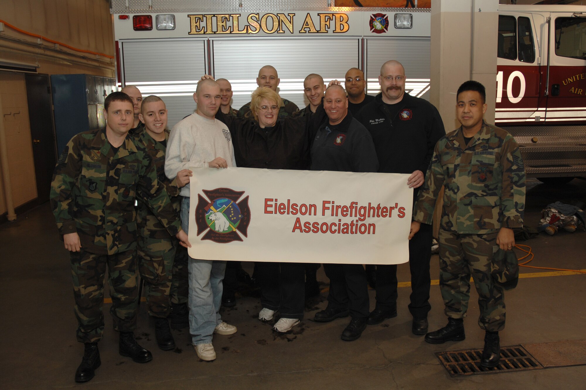 EIELSON AIR FORCE BASE, Alaska -- Members of the Eielson Fire Fighter Association pose for a photo after shaving their heads as a fundraiser for the St. Baldrick's Foundation which raises funds for childrens cancer research. Events such as this have taken place in 10 countries and 42 U.S. states, raising over $20 million and shaving more than 26,000 heads.
(U.S. Air Force Photo by Staff Sgt Joshua Strang)