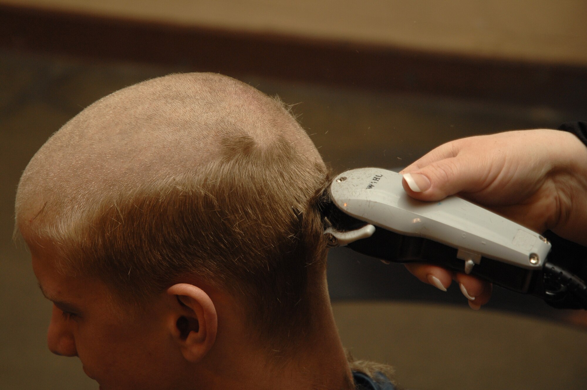 EIELSON AIR FORCE BASE, Alaska -- Airman Brian Daniels, 354th Civil Engineer Squadron fire fighter, gets his head shaved on March 15 at Fire Station #1. Members of the Eielson Fire Fighter Association shaved their heads to raise money for St. Baldricks Foundation which raises funds for childrens cancer research.
(U.S. Air Force Photo by Staff Sgt Joshua Strang)