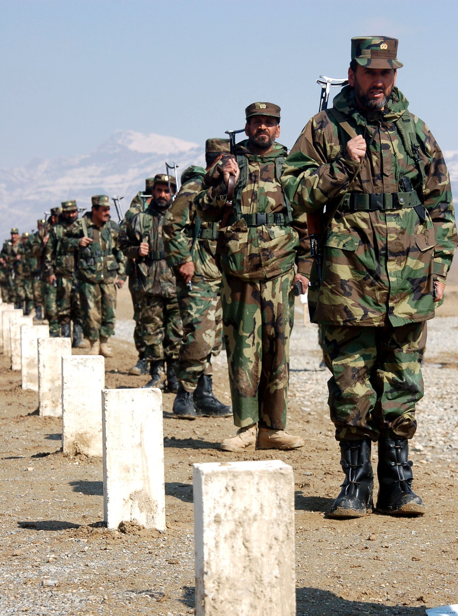 Afghan National Army soldiers line up at firing positions March 14 on a range at the Kabul National Military Center in preparation for a live-fire drill.  (U.S. Air Force photo/Senior Airman Stacia Zachary)