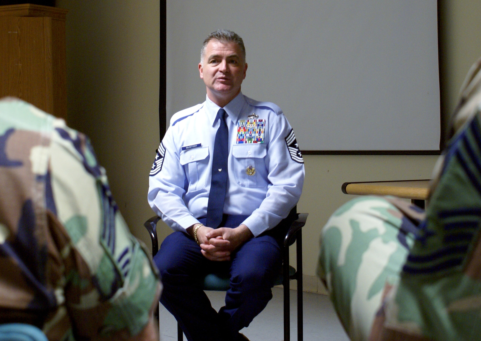Air Force Reserve Command Chief Master Sgt. Troy J. McIntosh speaks with base chiefs at Homestead Air Reserve Base, Fla., March 7. He first held an enlisted call during which he discussed key issues such as ancillary training, leadership, mentoring and how to be successful as a reservist. March 7 was the Chief's first day in his new position. (U.S. Air Force photo/Ryan Ayers)