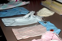 Clothing created by the Mad Hatters for premature and stillborn babies birthed at Wilford Hall Medical Center are often constructed from elaborate templates and patterns, designed with the grieving parents in mind. The Lackland Air Force Base, Texas, Mad Hatters convene every second Tuesday of the month in the Freedom Chapel, from 9:30 a.m. to 1:30 p.m. Mad Hatters was originally designed to make hats for recovering cancer patients dealing with hair loss from therapy. Now it's grown to accommodate other physical ailments, such as pillows for recovering mastectomy patients. (USAF photo by Staff Sgt. Vincent Borden)                                   