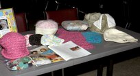 A small sample is shown of various crocheted hats and pillows made by Mad Hatters for recovering cancer patients at Wilford Hall Medical Center at Lackland Air Force Base, Texas. Mad Hatters was originally designed to make hats for recovering cancer patients dealing with hair loss from therapy. Now it's grown to accommodate other physical ailments, such as pillows for recovering mastectomy patients, and emotional ailments, such as clothes for stillborn babies being laid to rest. (USAF photo by Staff Sgt. Vincent Borden)                               