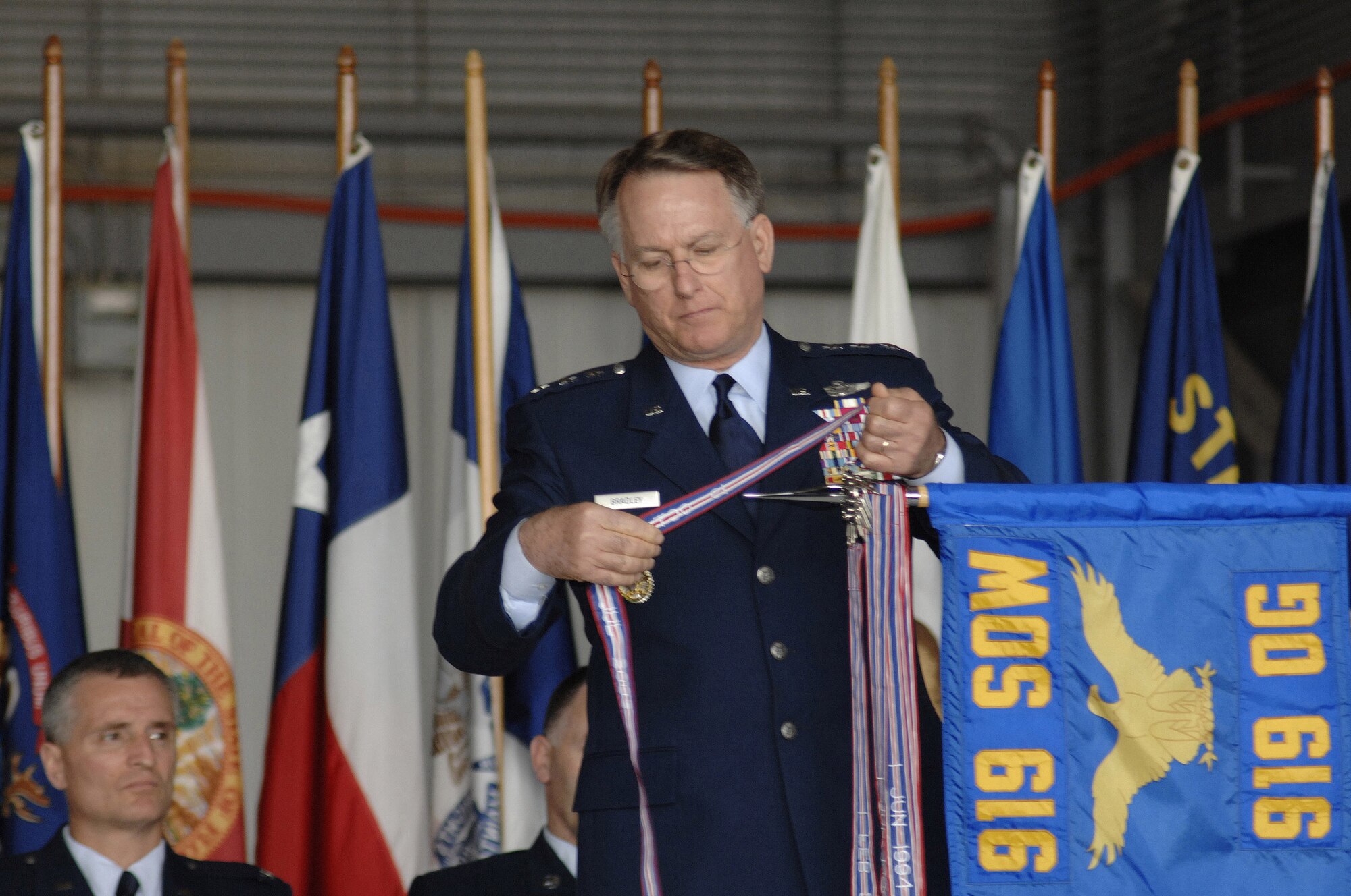 Lt. Gen. John A Bradley, commander of Air Force Reserve Command and chief of the Air Force Reserve, presents the 919th Operations Group from the 919th Special Operations Wing, Duke Field, Fla., with the Gallant Unit Citation March 3. The 919th OG is the first Reserve unit to receive this award. (U.S. Air Force Photo \ Mike Fleck)