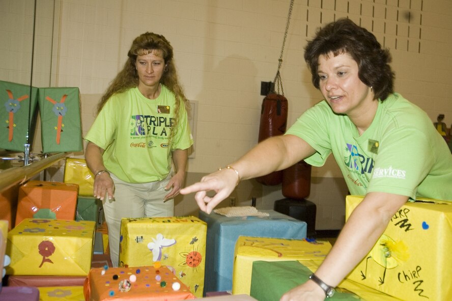 MINOT AIR FORCE BASE, N.D. – Rachel Miller (right) and Kimberly Sheridan, both from the David C. Jones Youth Center, organize Easter boxes at the youth center March 14. The boxes will be used for the Easter-themed Teen Flashlight Money Hunt at the youth center March 24. The youth center was recently awarded the 2006 Air Force Services Youth Program of the Year. (U.S. Air Force photo by Senior Airman Danny Monahan)