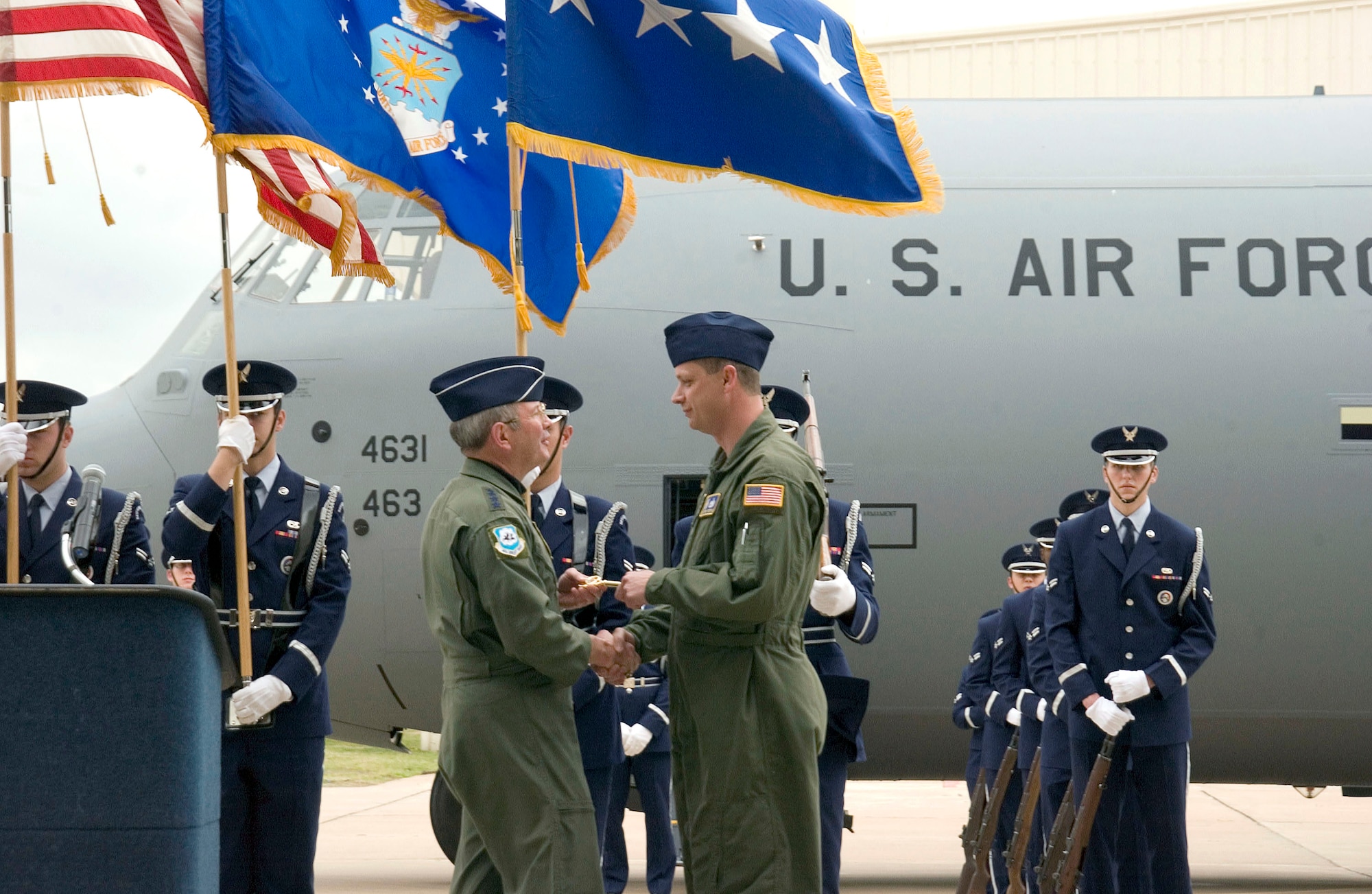 General Duncan McNabb, Air Mobility Command commander, presents the "key" to a new C-130J model March 13 to Tech. Sgt. Terry Fitzgerald who represented the 463rd Airlift Group at Little Rock Air Force Base, Ark.  General McNabb personally delivered the aircraft to the 463rd.  It is the unit's first J-model and will be used in combat operations around the world. (U.S. Air Force photo/Airman 1st Class Nathan Allen)