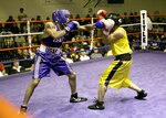 Rosey Summerville from Shaw AFB, S.C., throws a left jab at Christopher Munar from Fort Carson, Colo., during the U.S. Armed Forces Boxing Championship finals March 9 at Bennett Fitness Center on Lackland Air Force Base, Texas. (USAF photo by Robbin Cresswell)