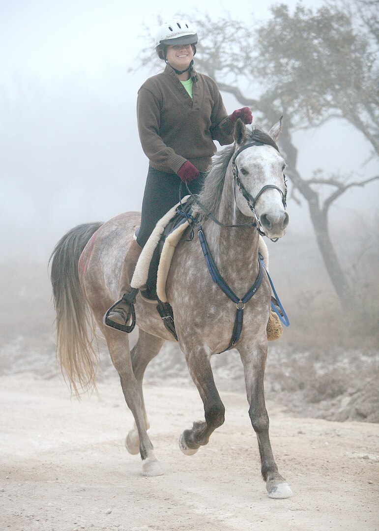 Capt. Julianne Philip competes in an endurance ride with her horse SN Independance on March 10 in Borene. This is Captain Phililp's first 50-mile ride. She finished in 9 hours and 26 minutes and placed 17th out of a field of 36 50-mile riders. Unlike most races where placement is determined by who crosses the finish line first, placement in an endurance ride is based on the horse's physical condition at designated vet check points on the trek. Captain Philip is a nurse manager with the 759th Surgical Operations Squadron at Wilford Hall. (USAF photo by Robbin Cresswell)