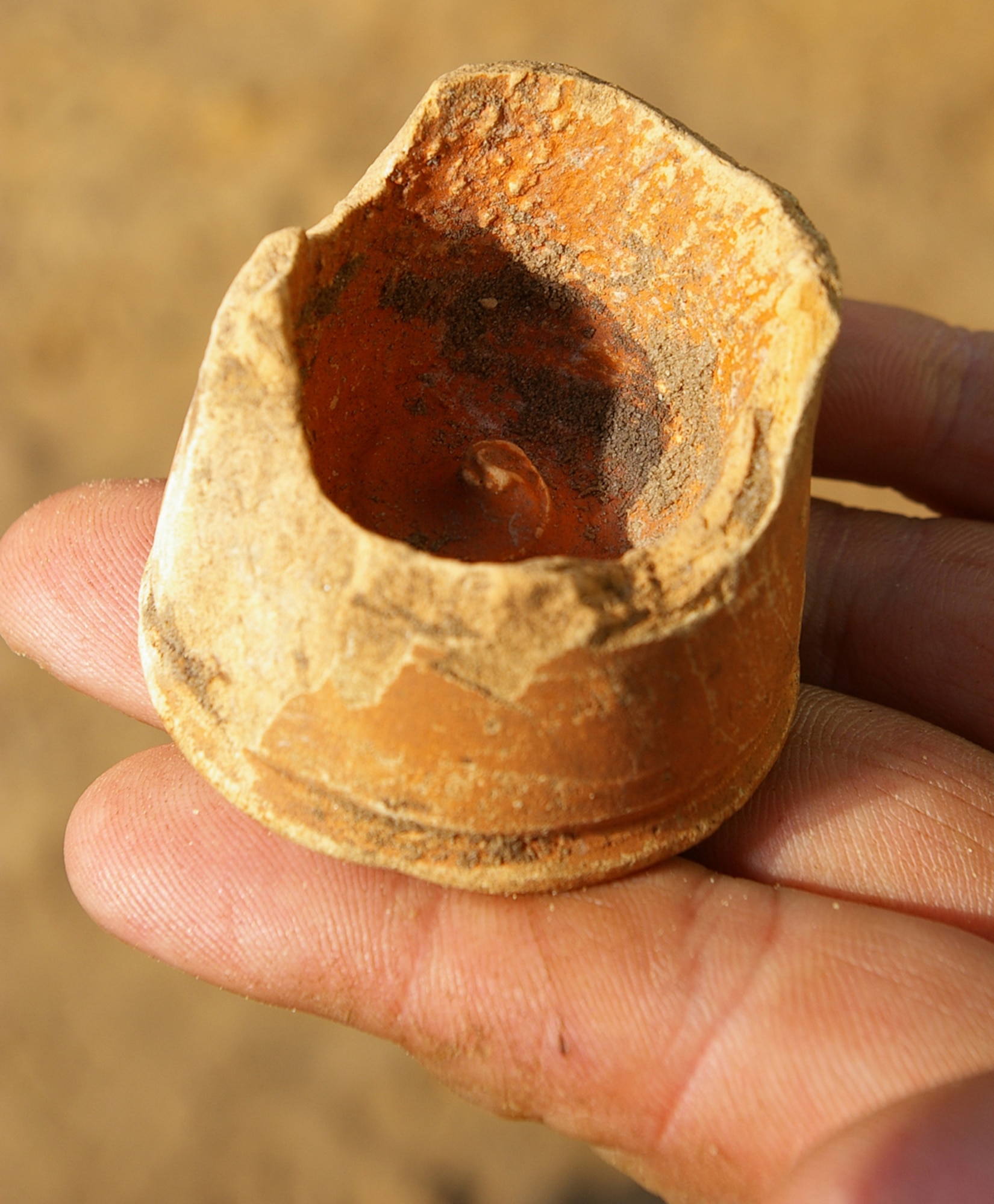 A piece of pottery, thought to be Roman, was found at the RAF Mildenhall officers' housing area in Beck Row during an archeological dig by the Suffolk County Council archeological service. A human skeleton was also discovered March 12, and was finally uncovered March 14. The skeleton has now been removed from the area and will be studied by archeology specialists. (Air Force photo by Karen Abeyasekere)