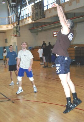 OSAN AIR BASE, Republic of Korea --  Mike Hogen covers a lot of court by overhand passing a serve up to his setter. The overhand pass rule was instituted back in 1996. (U.S. Air Force photo by Master Sgt. Steven Goetsch) 