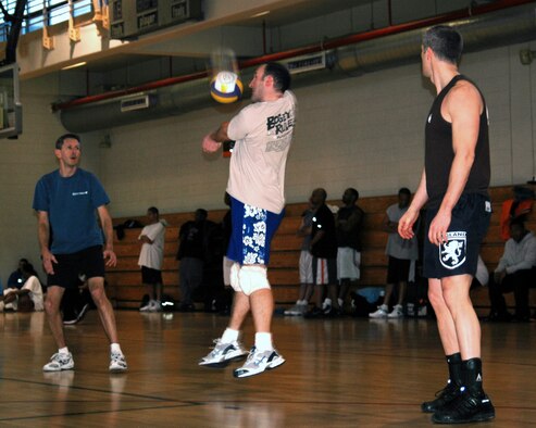 OSAN AIR BASE, Republic of Korea --  Sven Hochheimer (center) finds himself in a bad position while passing the ball as his teammates, Mike Hogen and Mike Sapp look on. (U.S. Air Force photo by Master Sgt. Steven Goetsch)