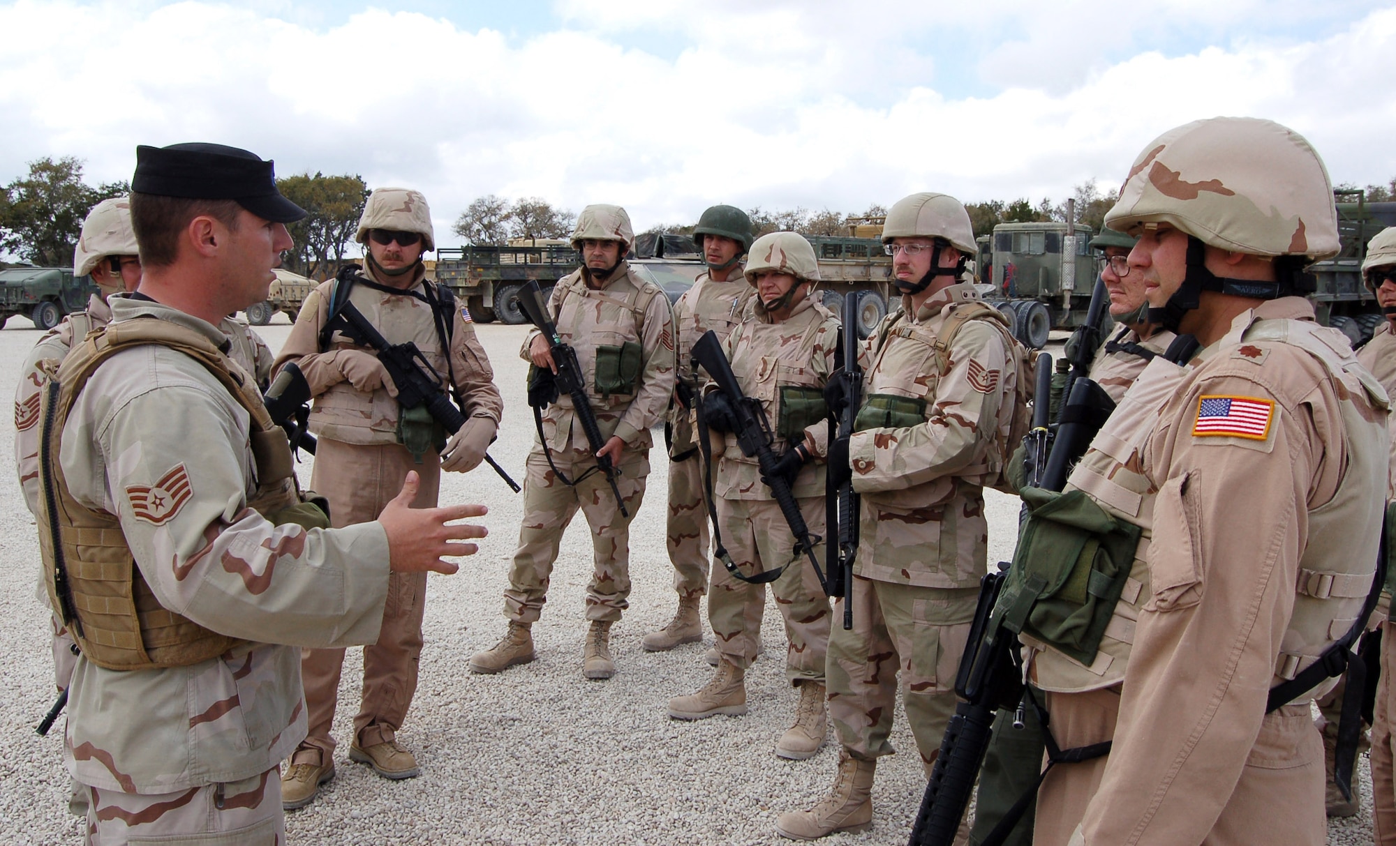 Staff Sgt Wayne Tokarz briefs students about combat convoy procedures. Sergeant Tokarz is an instructor for a specialized mission course being held at Camp Bullis, Texas. The two week course is the students first step in a mission that will help the Iraqi air force rebuild their technical schools. (U.S. Air Force photo/ Airman 1st Class Robbie Arp) 