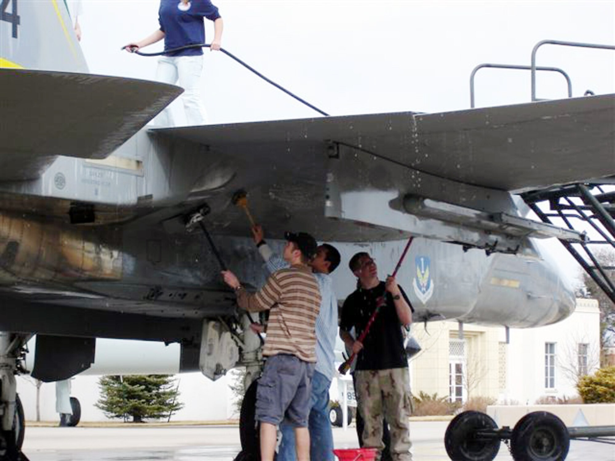 Air Academy HS JROTC cadets recently spent a Saturday afternoon washing the Peterson Museum's F-15 aircraft as part of the Museum's "Adopt-A-Plane" program. The museum is seeking other organizations to help preserve its aircraft and missile collection with periodic washing, waxing and minor maintenance. (U.S. Air Force photo)