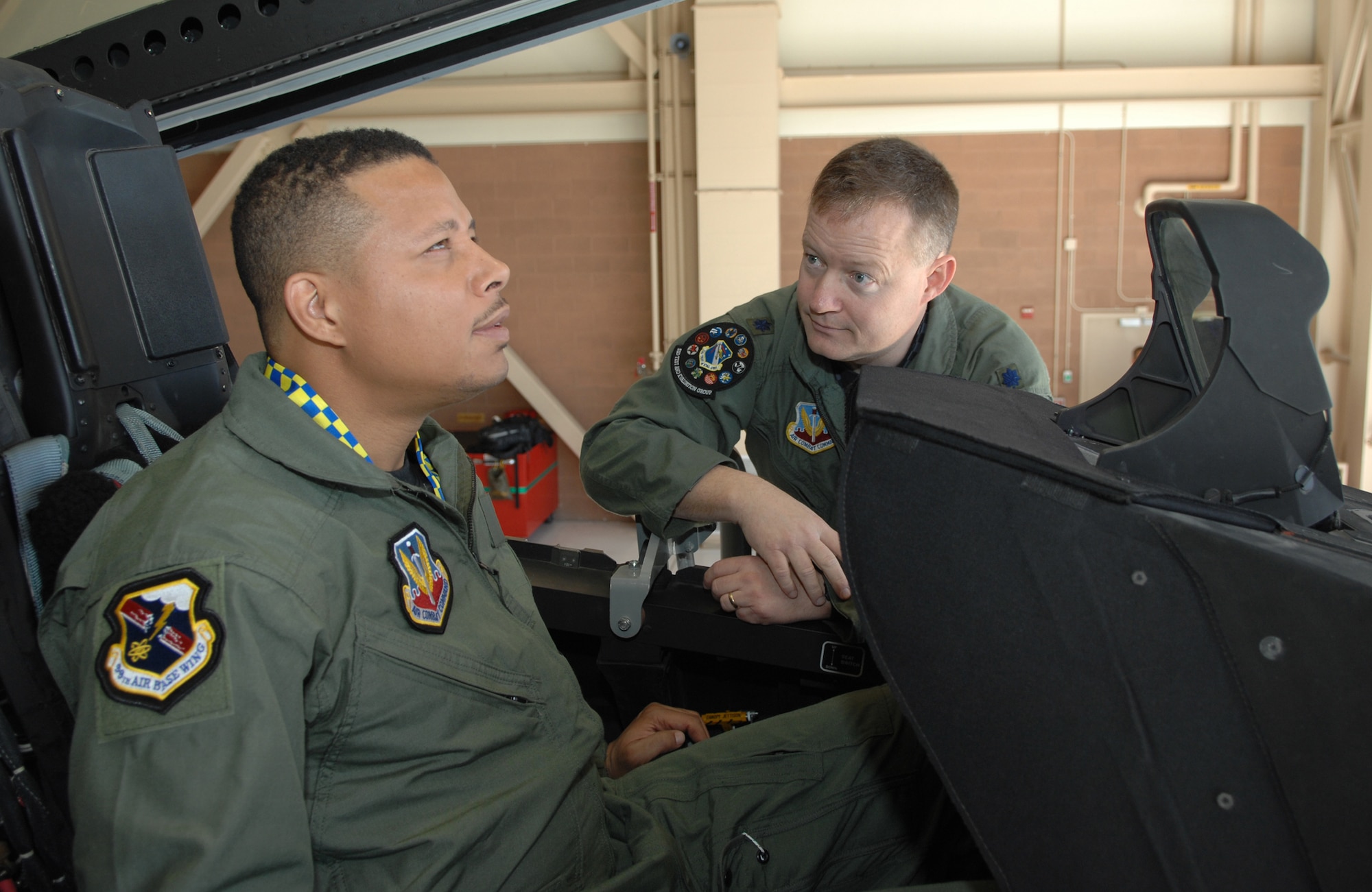 Lt. Colonel Dave Rose, 53rd Test and Evaluation Squadron deputy commander, briefs Oscar-nominated actor Terrence Howard on the F-22 Raptor at Nellis Air Force Base, Nev. on March 16. Mr. Howard will be starring in  “Iron Man,” which begins filming soon. The U.S. Air Force will be depicted in a number of scenes in the film. (U.S. Air Force photo by Tech. Sgt. Scottie McCord)