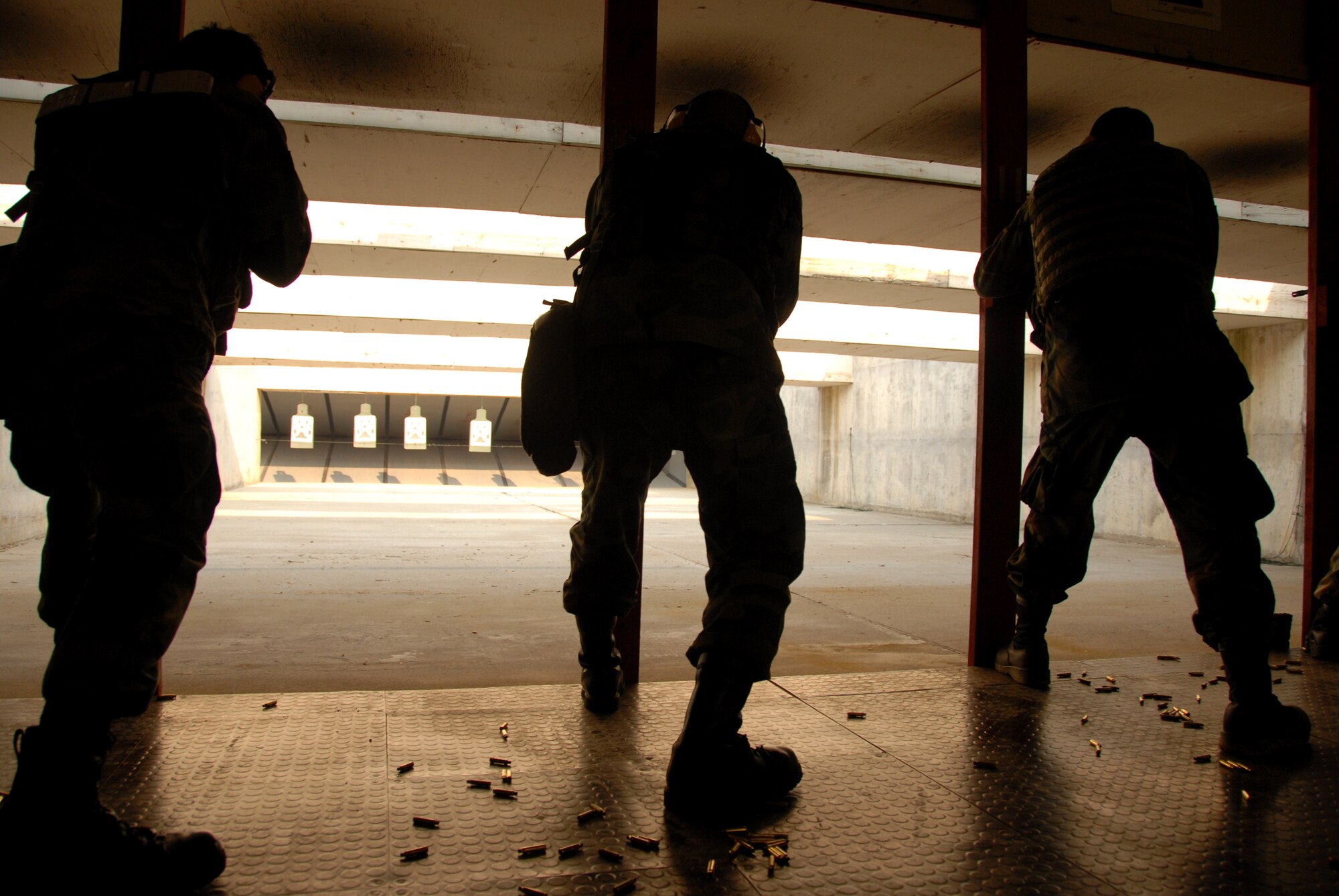 Airmen test their skills at the Osan Air Base, South Korea, shooting range March 15.  (U.S. Air Force photo/Airman 1st Class Chad Strohmeyer).