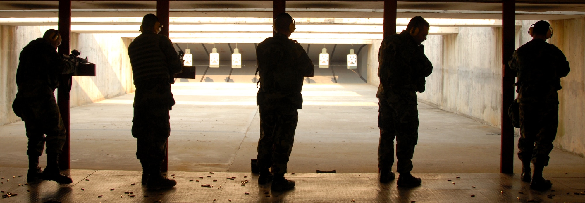 Airmen test their skills at the Osan Air Base, South Korea, shooting range March 15.  (U.S. Air Force photo/Airman 1st Class Chad Strohmeyer).