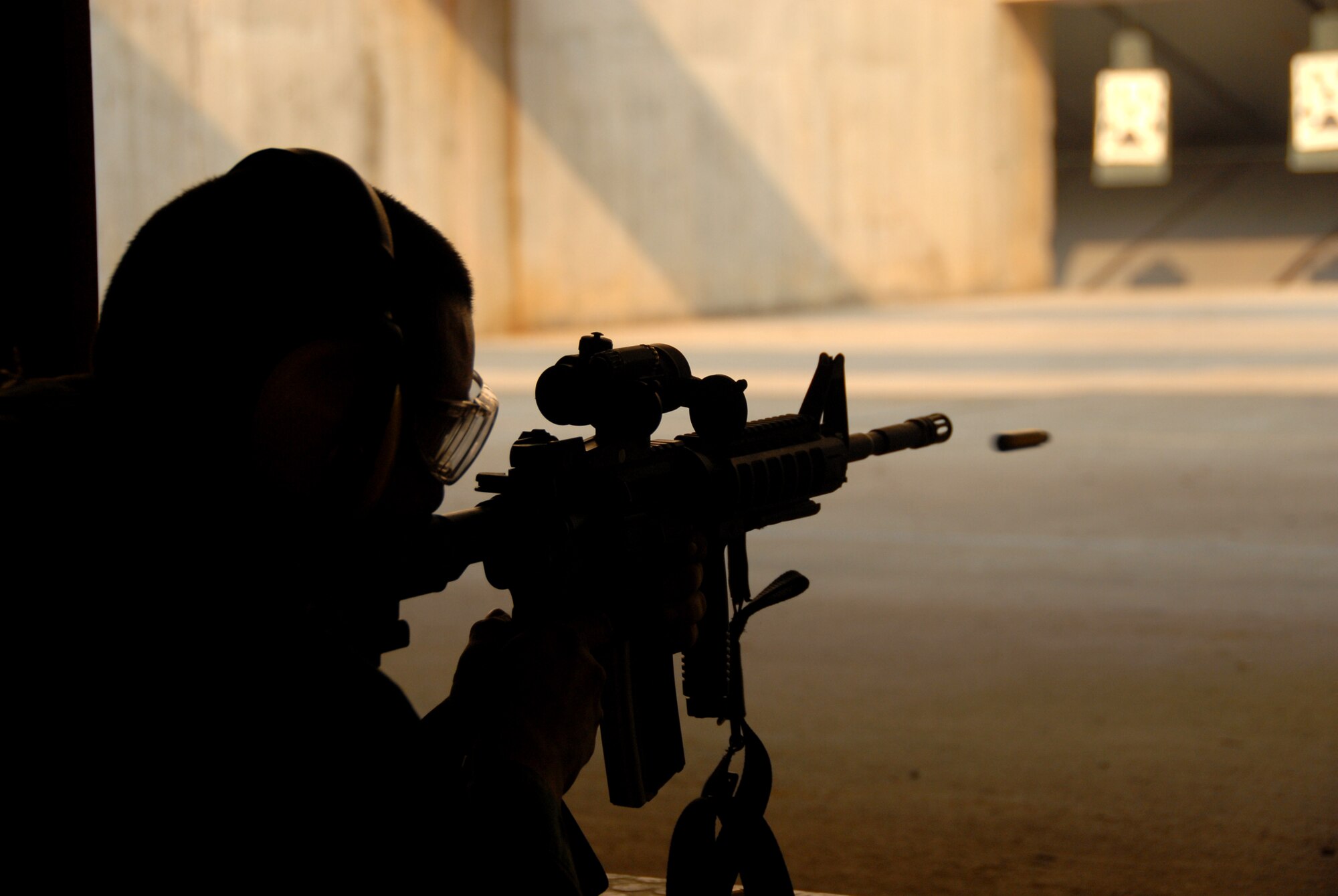 An Airman tests his skills at the Osan Air Base, South Korea, shooting range March 15.  (U.S. Air Force photo/Airman 1st Class Chad Strohmeyer).