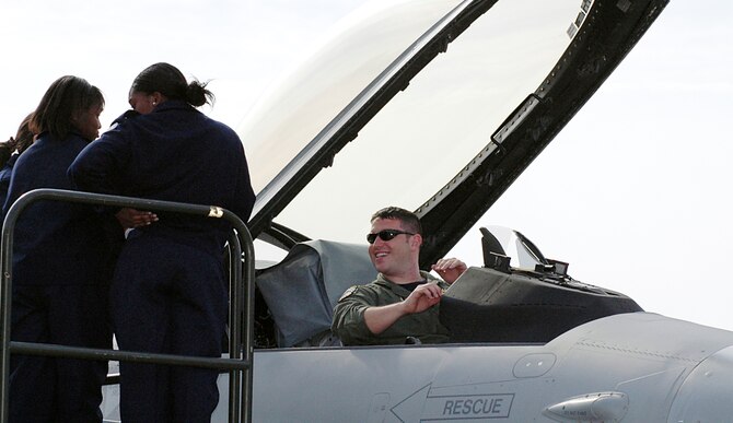 Air Force JROTC cadets converse with Capt. Lindsey Lamb, 93rd Fighter Squadron pilot of Homestead Air Reserve Base, Fla. on what it takes to pilot an F-16 during JROTC Week at Dobbins ARB, Ga.  (U.S. Air Force photo/Senior Airman Robert Dennard)