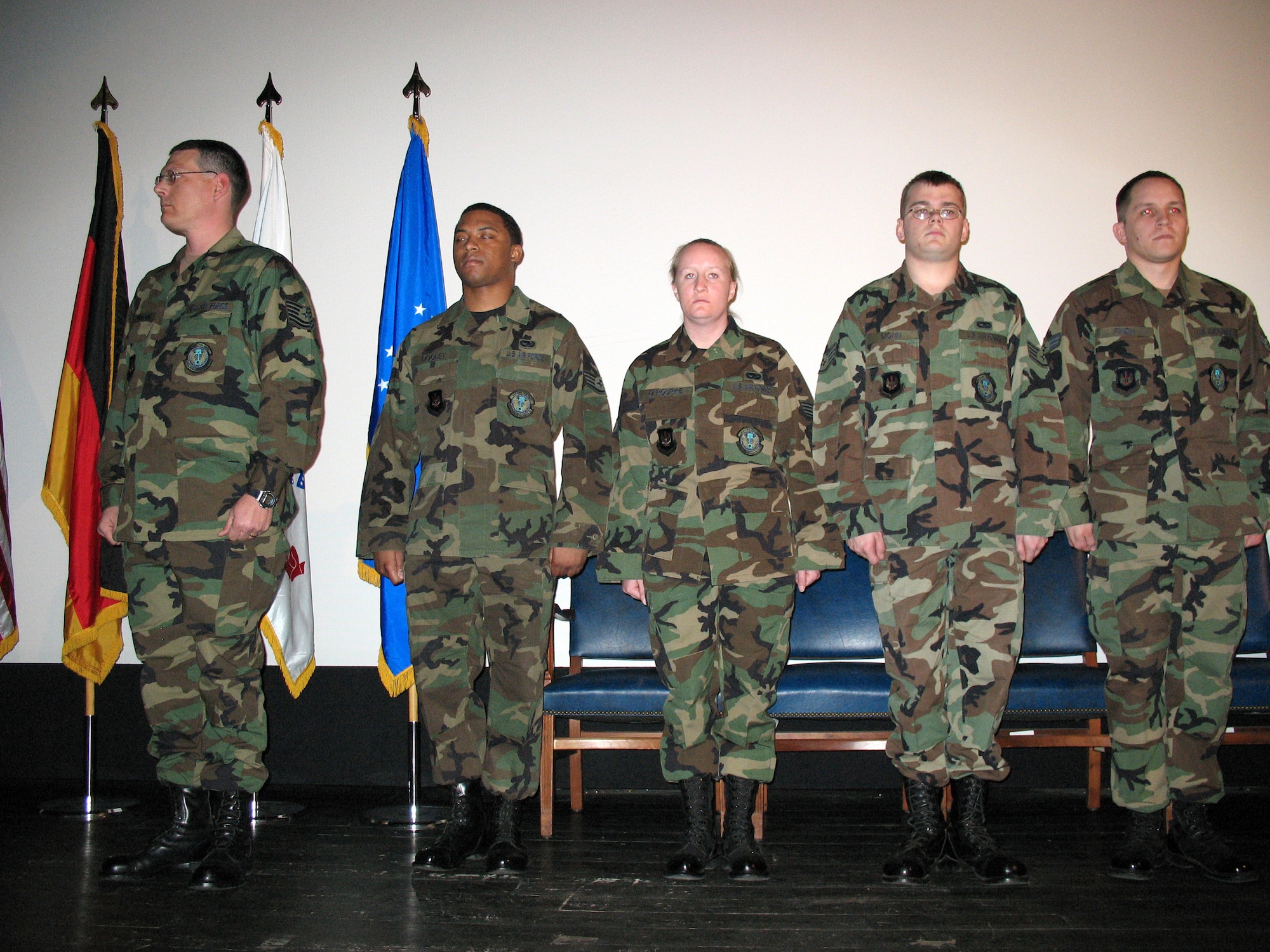 Five Airmen from the 435th Vehicle Readiness Squadron at Ramstein Air Base, Germany await the presentation of their Army Combat Action Badges March 16. The Airmen were involved in combat during a deployment in support of the Army last year in Iraq. (U.S. Air Force Photo/ SSgt Jason David) 