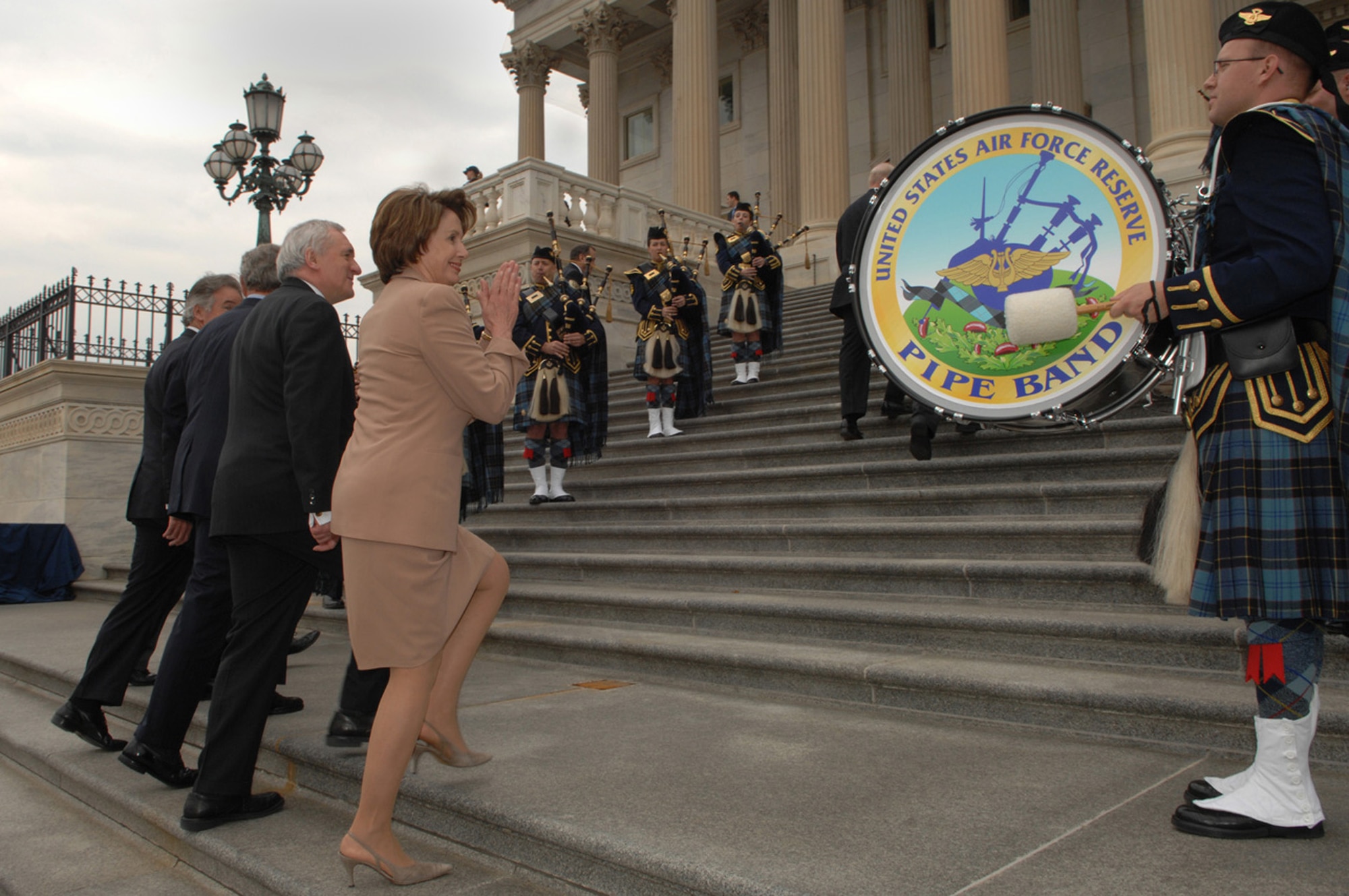 From right: Speaker of the U.S. House of Representatives Nancy Pelosi, Irish Prime Minster Bertie Ahern, President George Bush and Irish Foreign Minister Dermot Ahern ascend the outside steps of the U.S. Capitol Building in Washington D.C., on March 15, 2007, while the Band of the Air Force Reserve Pipe Band performs traditional Celtic music. Since 1993 the Air Force Reserve Pipe Band has been invited to perform on Saint Patrick's Day for the president of the United States and the prime minister of Ireland during their annual lunch. This year the pipe band was also invited to perform in the New York City Saint Patrick's Day Parade. (U.S. Air Force photo/Airman First Class Timothy Chacon)