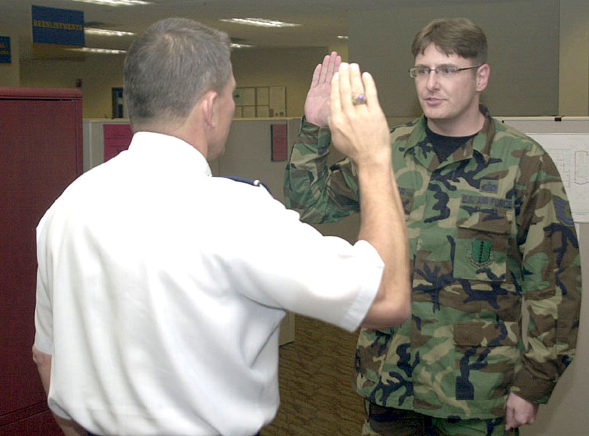 Maj. General Michael Gould, 2nd Air Force commander, administers the Oath of Enlistment to then-Tech. Sgt. Derrick Lepper of the 17th Mission Support Group, just before promoting him to master sergeant March 8.  Master Sgt. Lepper was promoted under the Stripes for Exceptional Performers program.  (U.S. Air Force photo by Airman 1st Class Stephen Musal)