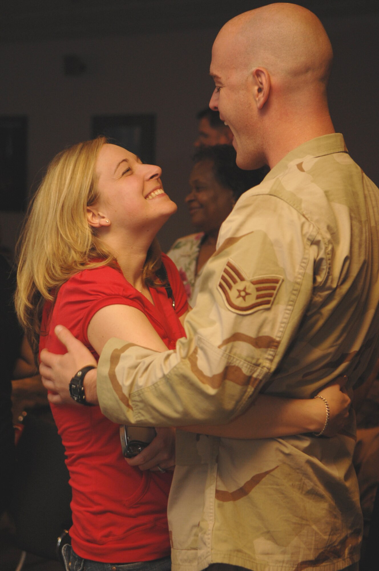 A staff sergeant from the 41st Rescue Scuadron is welcomed home by his wife March 15 after returning from a four-month deployment to Iraq. (U.S. Air Force photo by Airman 1st Class Gina Chiaverotti)