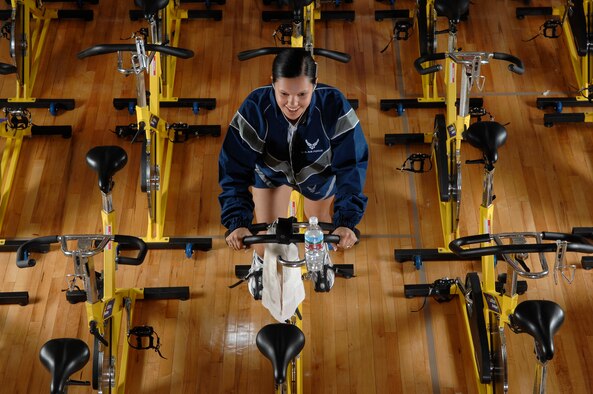 Staff Sgt. Irene Noriega assigned to the 62nd Airlift Wing at McChord Air Force Base, Wash., participates in a zero-impact, fat burning, full body cardiovascular workout spin class March 9 at the McChord fitness center annex. (U.S. Air Force photo/Abner Guzman)