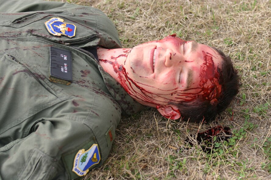 LAUGHLIN AIR FORCE BASE, Texas -- With a fake laceration to his forehead, 2nd Lt. Eric Davison waits for emergency personnel to respond to a simulated tornado touch down near Outdoor Recreation.  (U.S. Air Force photo by Amn Sara Csurilla)