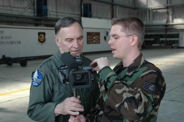 SPANGDAHLEM AIR BASE, Germany -- Gen. Tom Hobbins, U.S. Air Forces in Europe commander, talks with Staff Sgt. Brandon Hoyt, American Forces Network, Detachment 9, about a commercial being filmed for AFN here March 15.