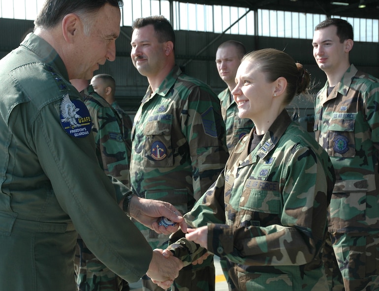 SPANGDAHLEM AIR BASE, Germany -- Gen. Tom Hobbins, U.S. Air Forces in Europe commander, meets Capt. Jennifer Soles, 52nd Equipment Maintenance Squadron, while at Spangdahlem Air Base to shoot an American Forces Network commercial here March 15.