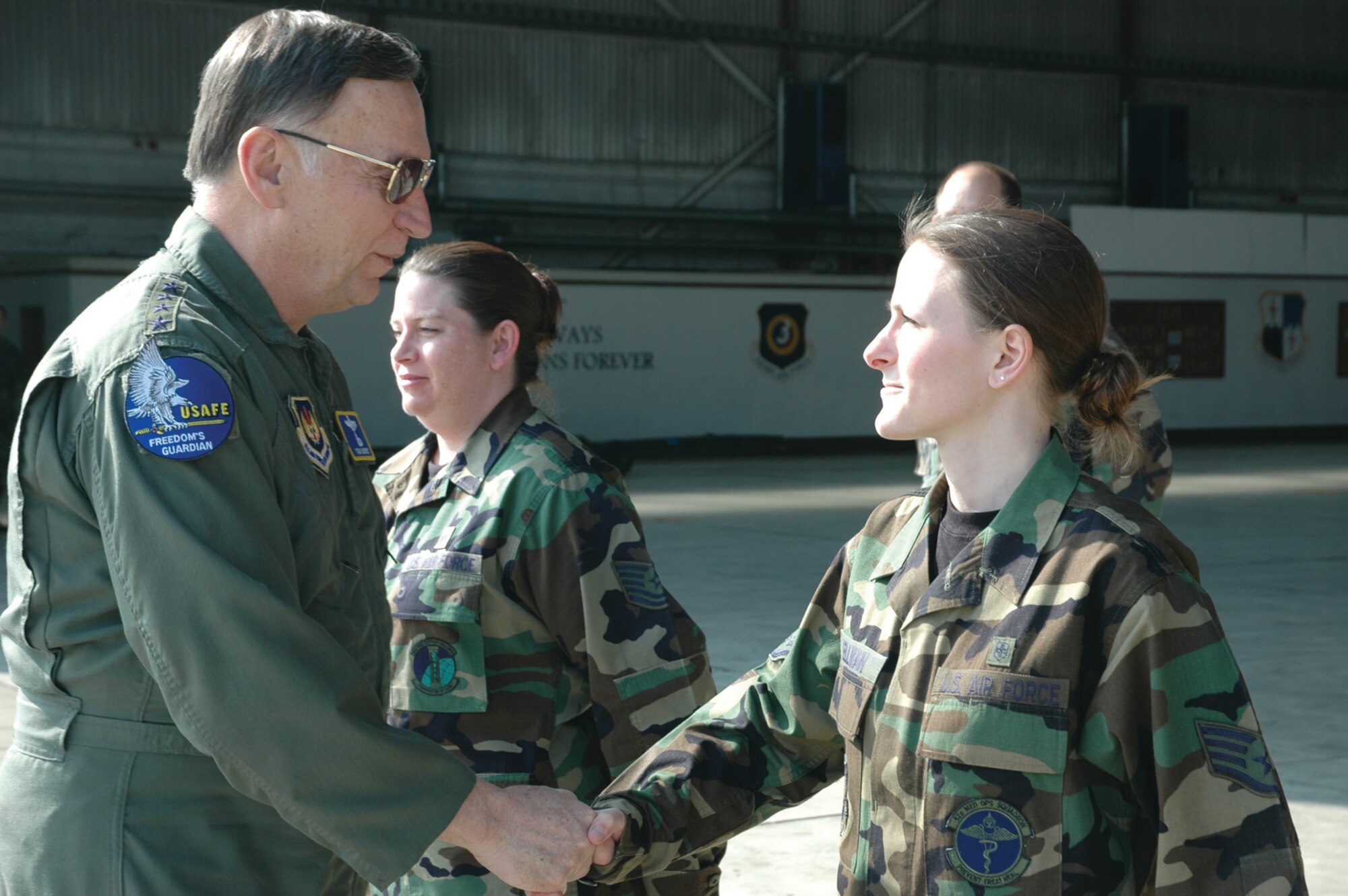 SPANGDAHLEM AIR BASE, Germany -- Gen. Tom Hobbins, U.S. Air Forces in Europe commander, meets Staff Sgt. Sharon Wellman, 52nd Medical Operations Squadron, while at Spangdahlem Air Base to shoot an American Forces Network commercial here March 15.