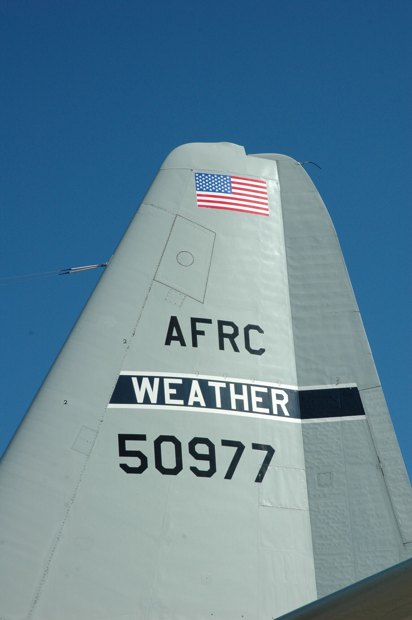 PATRICK AIR FORCE BASE, Fla. -- Tail number 977, a C-130H, formerly assigned to the 53rd Weather Reconnaissance Squadron "Hurricane Hunters" is now assigned to the 920th Rescue Wing, Patrick Air Force Base, Fla. 

After years of tracking down hurricanes, the H-model is now tracking down people in need of rescuing. The plane is scheduled to be repainted in the coming months and ready to fly rescue missions soon thereafter. The 403rd Wing replaced the H-model with the newer, more technologically advanced J-model, which climbs higher, faster and more efficiently. The last H-model left the 403rd Wing in January, 2006. (Air Force Photo by Major Chad E. Gibson)