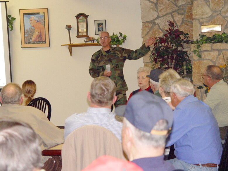 Lt. Col. Scott Meeker, 22nd Services Squadron commander, speaks about the possible fate of the Twin Lakes Golf Course, March 6, during a meeting in the golf course snack bar. In August 2006, Air Mobility Command recommended closing the course because it needed several repairs in order to be playable and profitable. Since then, the 22nd SVS has been working to keep Twin Lakes open; however, the squadron needs more help from golfers. When people play golf at Twin Lakes, the services squadron earns money to put back into the maintenance and upkeep of the course. Services plans to repair the course’s greens in April, install new driving range equipment in May and begin fertilizing the course more frequently throughout the year to make it more enticing to golfers. Nonetheless, services needs to turn a profit to properly maintain the course. People can help keep the course open by playing more rounds of golf and frequenting the course’s snack bar. (Air Force photo by Senior Airman Amanda Currier)
