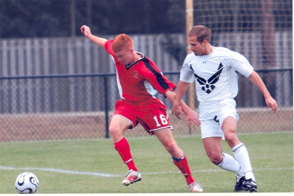 (Right) Staff Sgt. James Pastore, 305th Communications Squadron, fights for control of the ball during an Air Force vs. Marine Corps soccer game at the Armed Forces tournament held at Naval Station Mayport, Fla., from Jan. 15 to 22. Sergeant Pastore was selected as a member of the Air Force team and advanced to represent the Armed Forces team at Conseil International du Sports Militaire's 2007 World Military Games in Brazil.