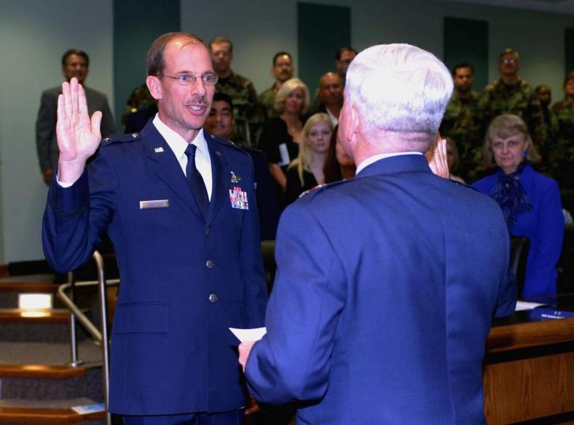 Newly promoted Brig. Gen. Jon R. Shasteen recites the military officer oath of office at a ceremony here March 3 from Maj. Gen. Allan R. Poulin, Vice Commander, Headquarters Air Force Reserve Command. Both general’s were assigned to Homestead Air Reserve Base during their careers and are both Mako pilots. General Shasteen credits opportunities to excel at Homestead ARB with his climb into flag officer status. (U.S. Air Force photo/Tech. Sgt. Paul Dean)