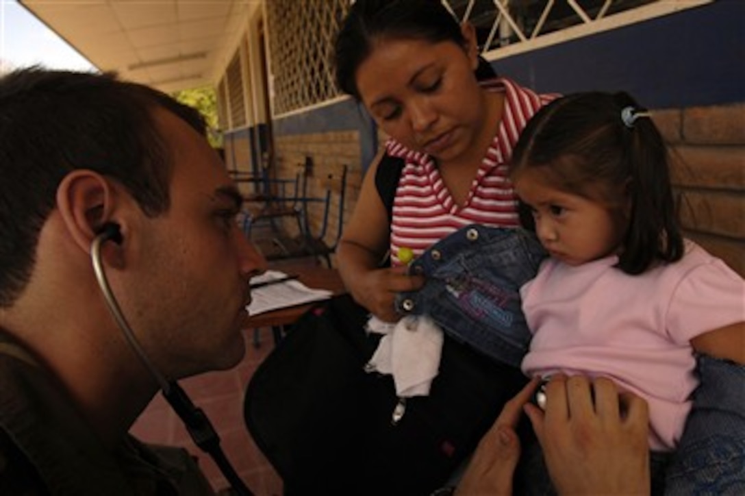 U.S. Army 2nd Lt. Russell Kies uses a stethoscope to evaluate a young girl as her mother holds her during a medical readiness training exercise as part of New Horizons-Nicaragua 2007 in Diriamba, Nicaragua, March 10, 2007.