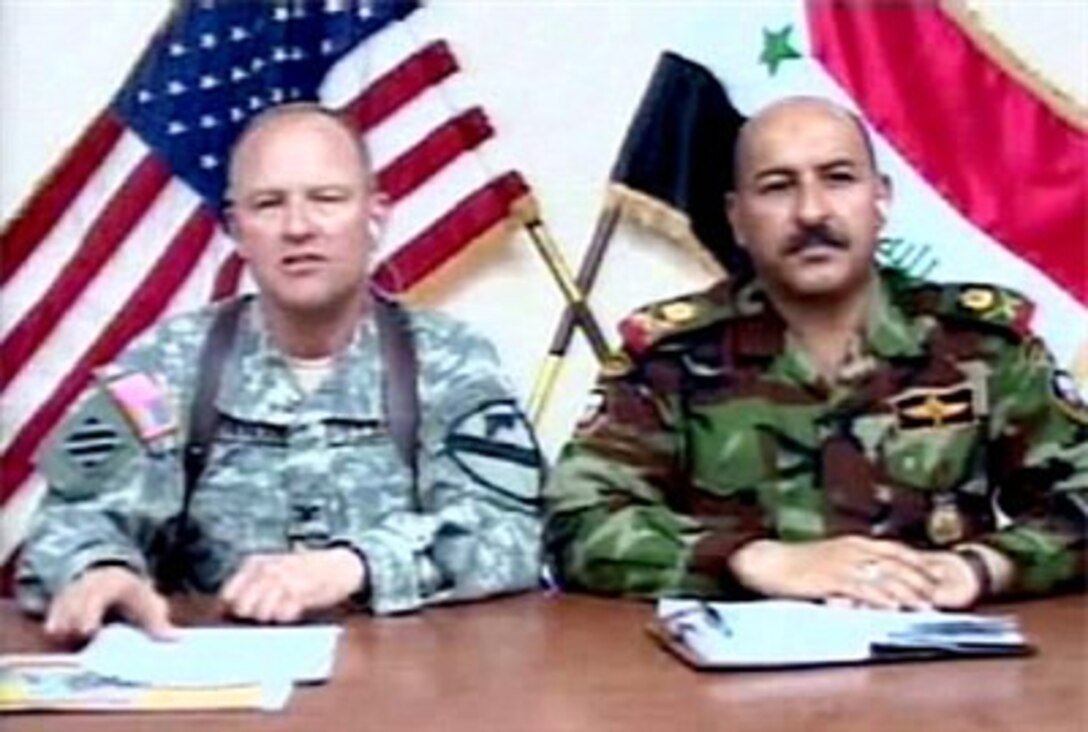 U.S. Army Col. David Sutherland, left, commander of 3rd Brigade Combat Team, 1st Cavalry Division, and Maj. Gen. Shakir Halail Husain, commander of 5th Iraqi Division, speak with reporters at Forward Operating Base Warhorse, Baqubah, Iraq,  to discuss the deployment of Strykers into Diyala, and Security Operations in and around Baqubah
