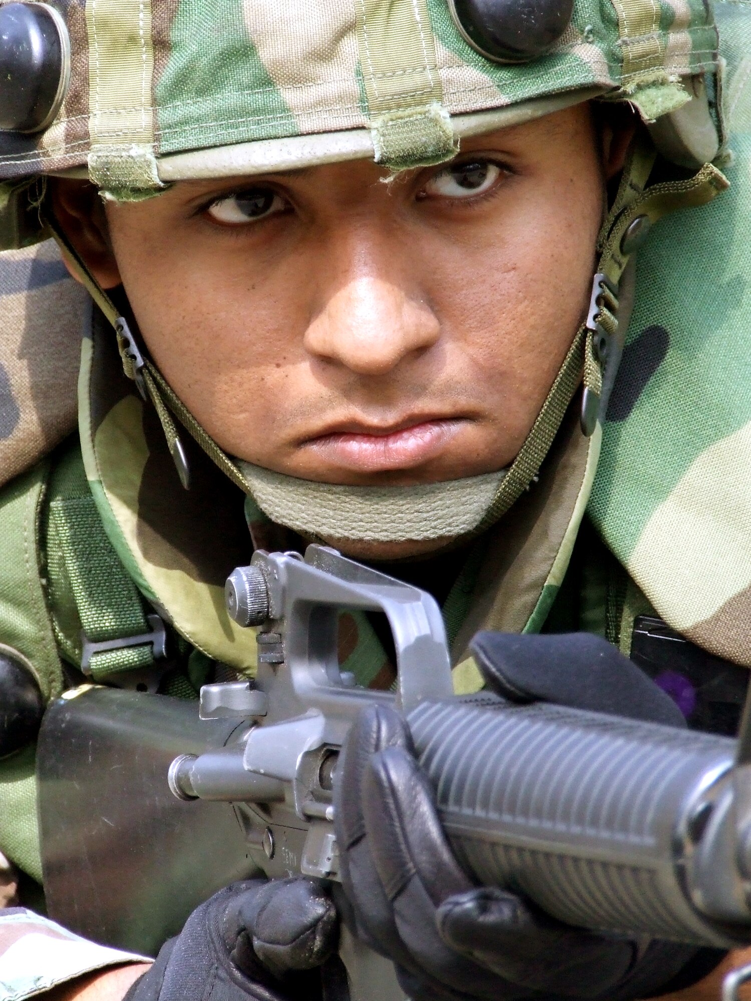 Airman 1st Class Jon Luna of Pope Air Force Base, N.C., practices squad and fire team manuevers with other students as part of a tactics and patrolling class for the Advanced Contingency Skills Training Course March 14on a range on Fort Dix, N.J. The course, made up of more than 300 students, prepares Airmen for upcoming deployments through teaching areas such as deployment tactics, patrolling, convoy operations and self defense. The course is taught by the U.S. Air Force Expeditionary Center's 421st Combat Training Squadron. (U.S. Air Force photo/Tech. Sgt. Scott T. Sturkol)