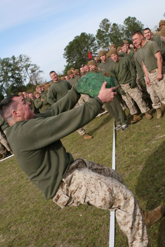 Marines from 8th Engineer Support Battalion, 2nd Marine Logistics Group, participate in the blarney stone toss during the St. Patrick?s Day Field Meet, here, March 18. The field meet was a way for the Marines and sailors of 8th ESB to celebrate the life of St. Patrick, the patron saint of engineers. During the blarney stone toss Marines competed to see who could throw the stone the furthest.