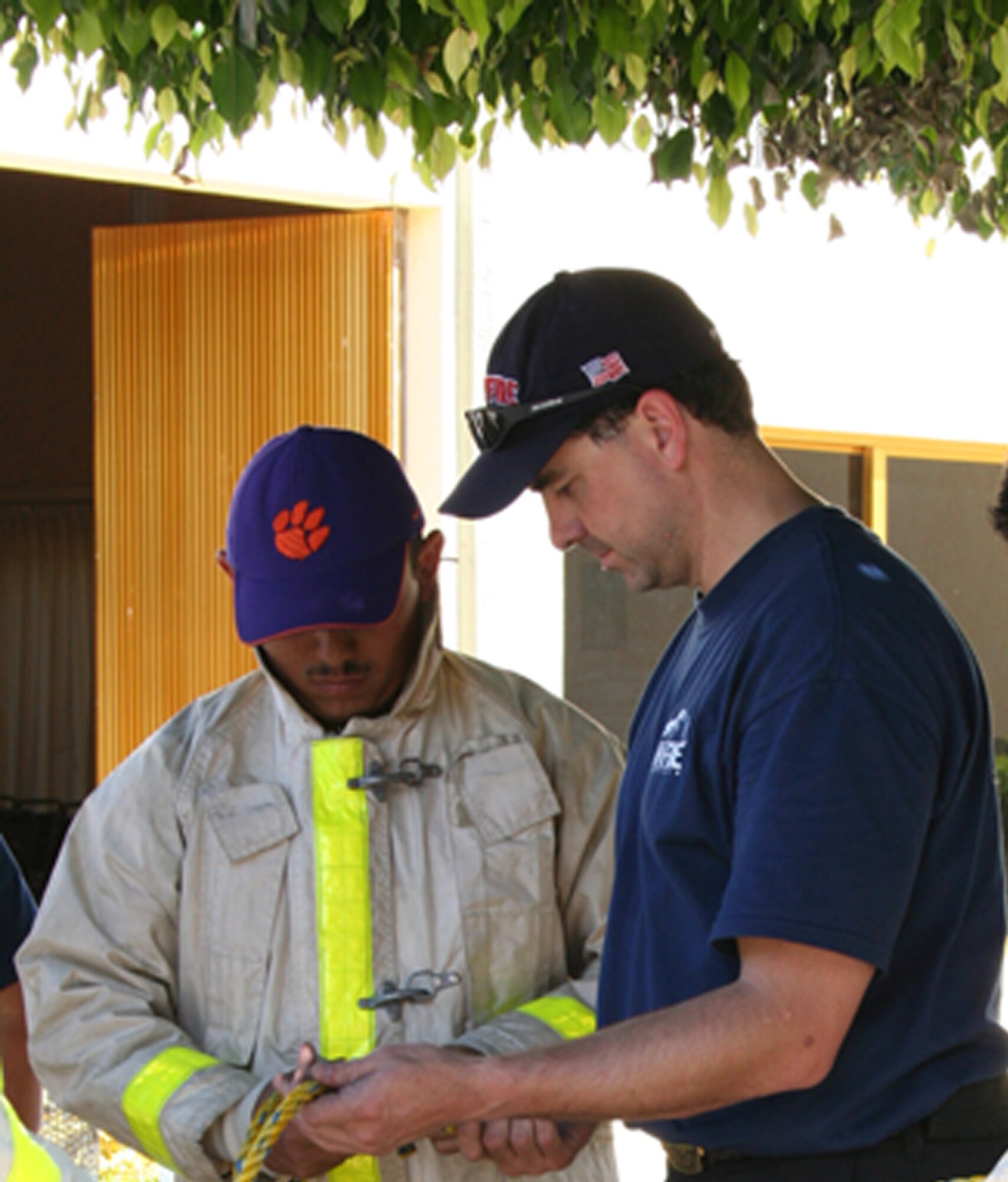 EL GRULLO, Mexico - Master Sgt. Scott Dellinger gives knot tying lessons to aof local volunteer firefighter while on his recent trip to El Grullo, Mexico.  Sergeant Dellinger is a reservist with the 728th Airlift Squadron, McChord Air Force Base, Wash. (Courtesy photo provided by Master Sgt. Scott Dellinger)