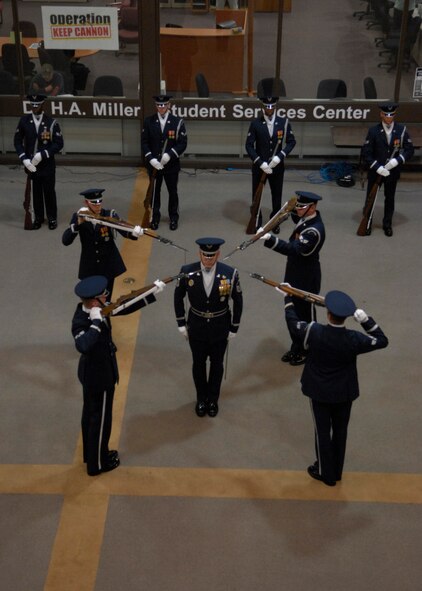 The United States Air Force Honor Guard Drill Team performs at Clovis Community College, Clovis, N.M., March 12, 2007. The Drill Team is the traveling component of the Air Force Honor Guard and tours Air Force bases world wide showcasing the precision of today's Air Force to recruit, retain, and inspire Airmen for the Air Force mission. (U.S. Air Force photo by Airman 1st Class Rusti Caraker)(Released)