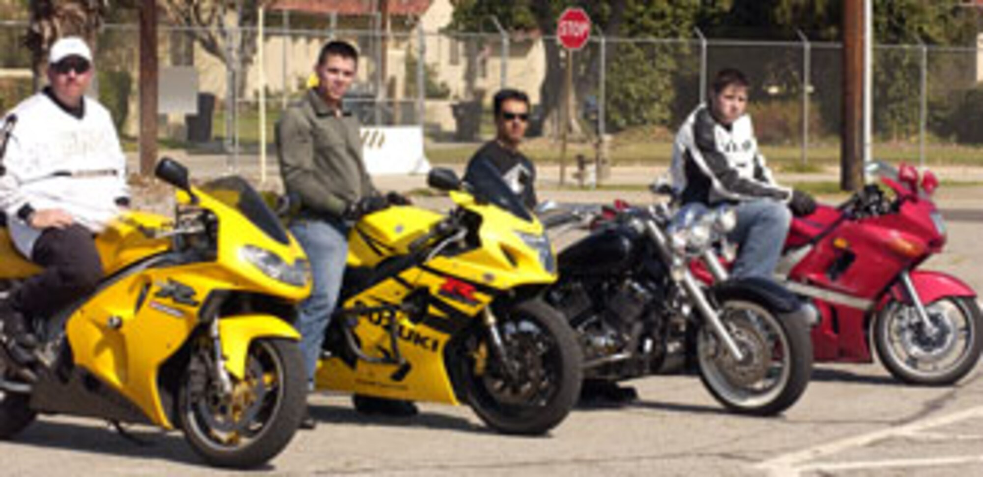 (Left to right) Volunteer instructor Gene Reeks, certified by the Motor Safety Foundation, students Senior Airman Jaime Hinojosa-Guzman, 452nd Logistics Readiness Squadron, Staff Sgt. Maro Mercado, 452nd Aircraft Maintenance Squadron and Caleb Hewitt, civilian contractor with the 163rd Reconnaissance Wing teach new riders at March Air Reserve Base. (U.S. Air Force photo by Staff Sgt. Amy Abbott)